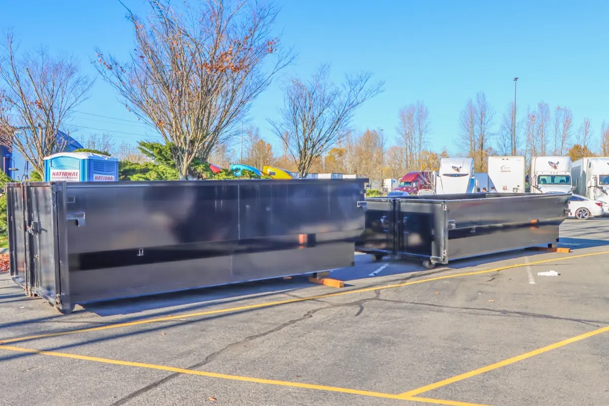 Professional dumpster rental service with roll-off container on residential driveway in Surprise